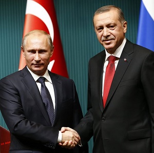 Russia's President Putin shakes hands with Turkey's President Erdogan after a news conference at the Presidential Palace in Ankara